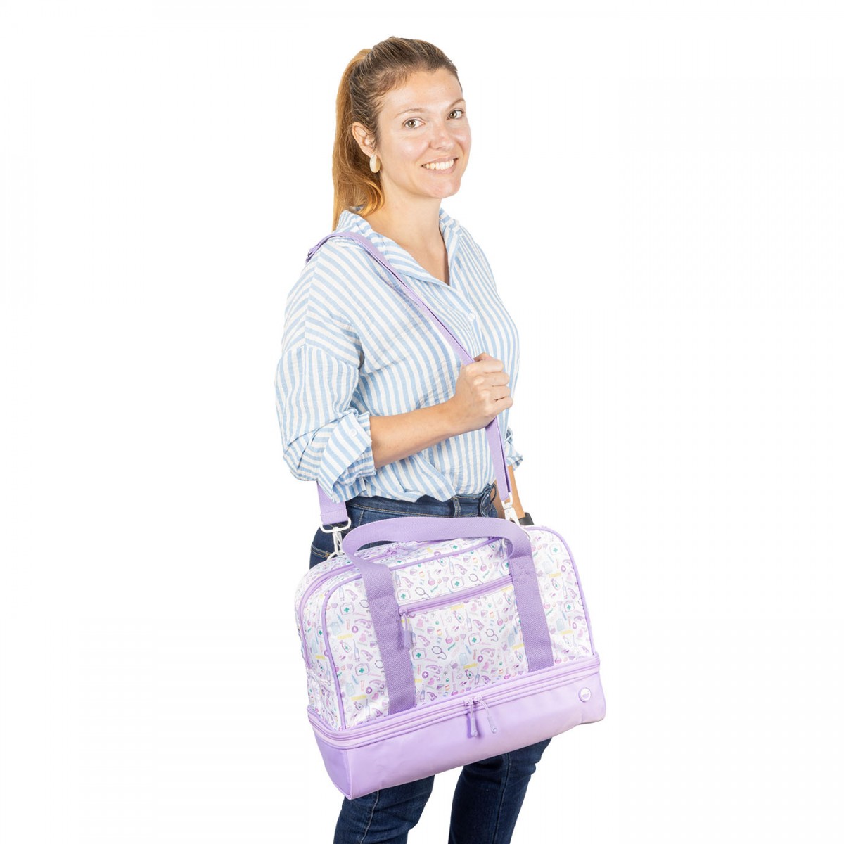 A light purple medical bag with medical motifs, carried by a healthcare worker, features a spacious interior and a separate insulated compartment ideal for long shifts.