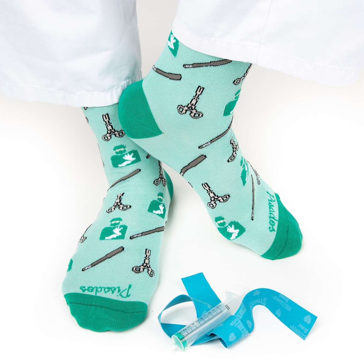 Light green socks with medical tools pattern, ideal for nurses, comfortable for long shifts.
