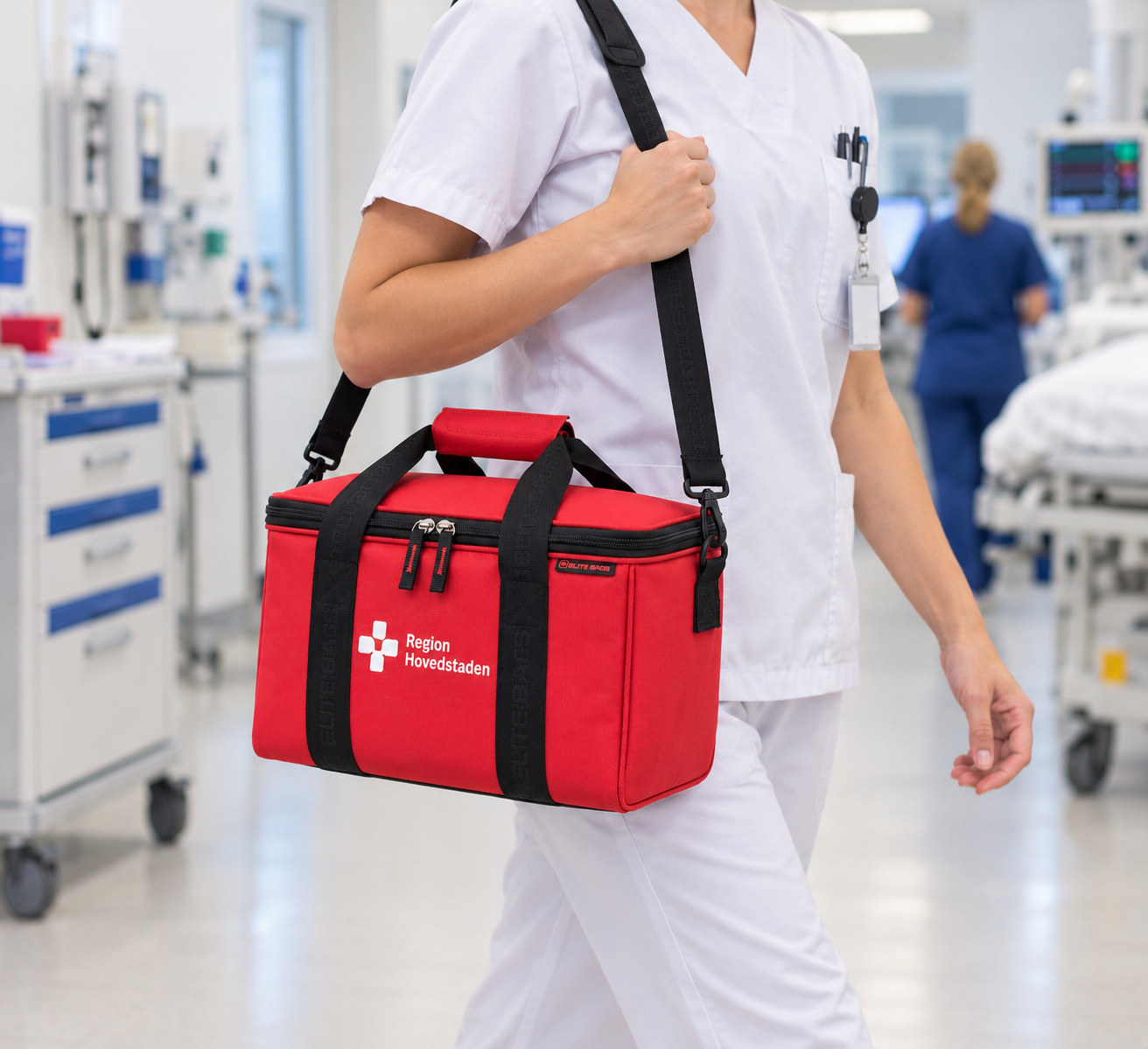 A red medical bag with a shoulder strap carried by a nurse in a hospital, featuring a durable design for organizing essential supplies.