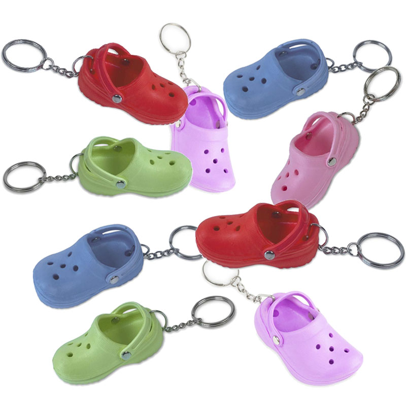 Colorful clog-style shoe keychains, ideal gifts for nurses, healthcare workers, and clinic staff. Available in blue, green, pink, purple and red colors.