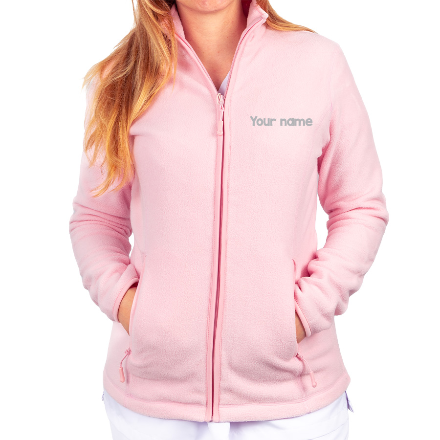 Pink fleece jacket for healthcare professionals, featuring a full zip and customizable name embroidery, ideal for layering.